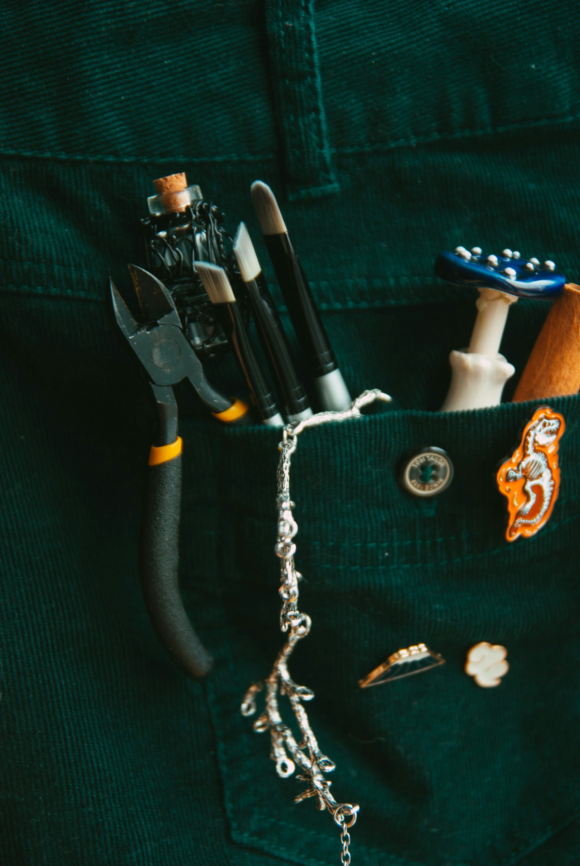 a pocket full of assorted items including a pair of scissors