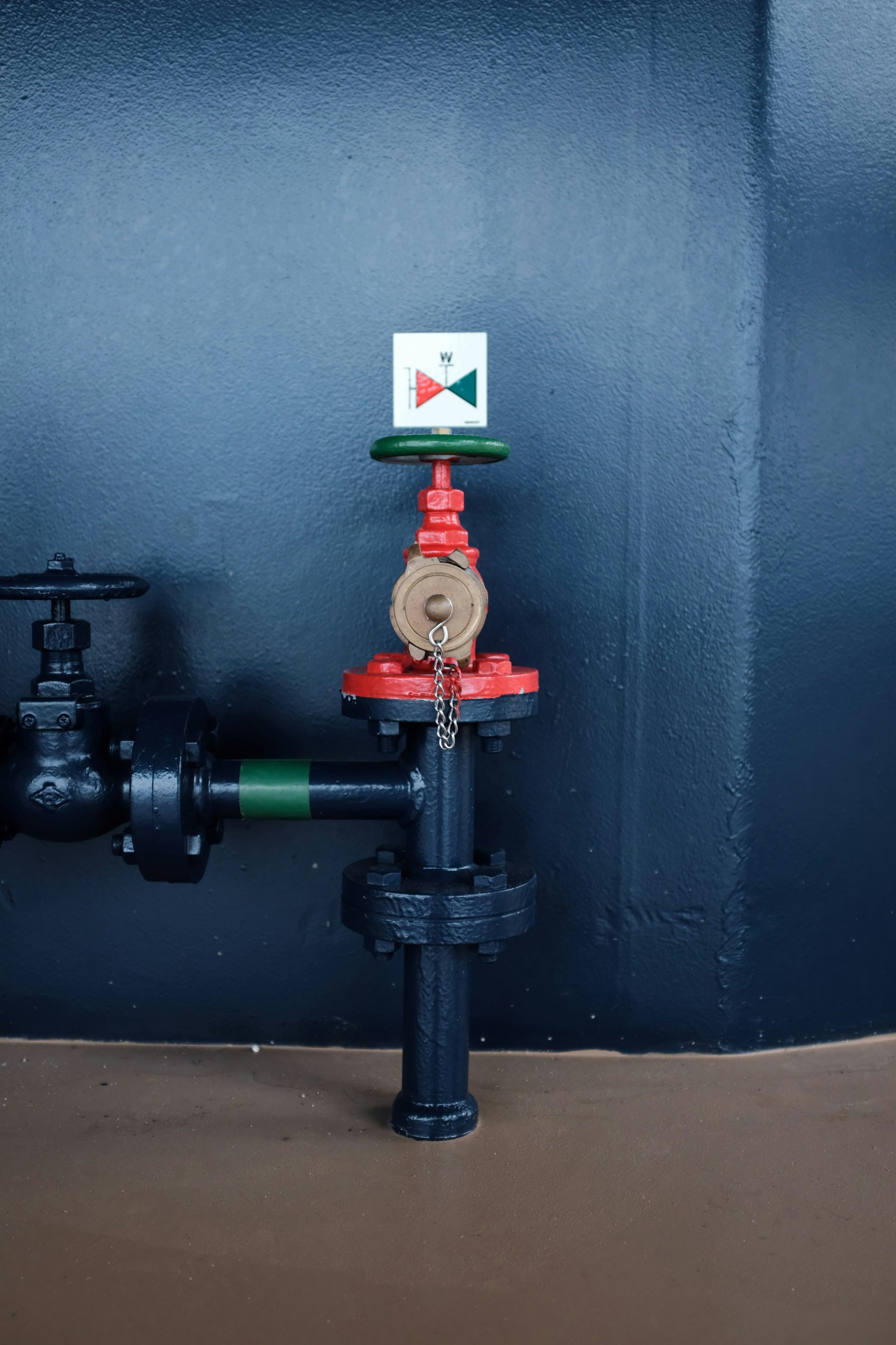 red and black pipe with valve